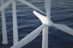 windmill in a body of water