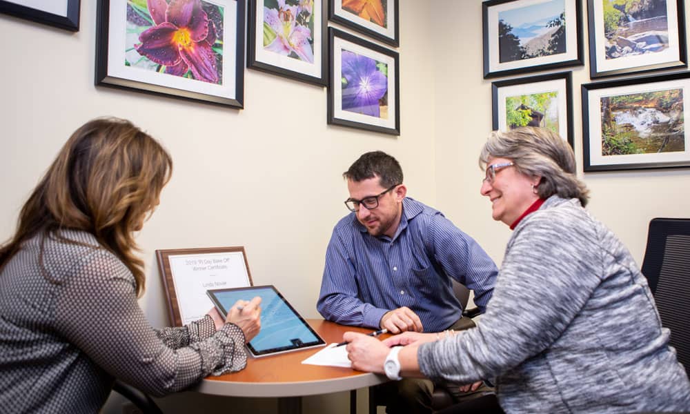 three PRI auditors discussing an audit