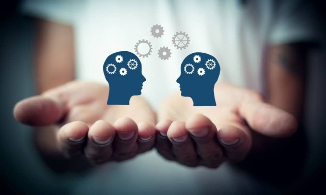 two hands holding graphics of knowledge