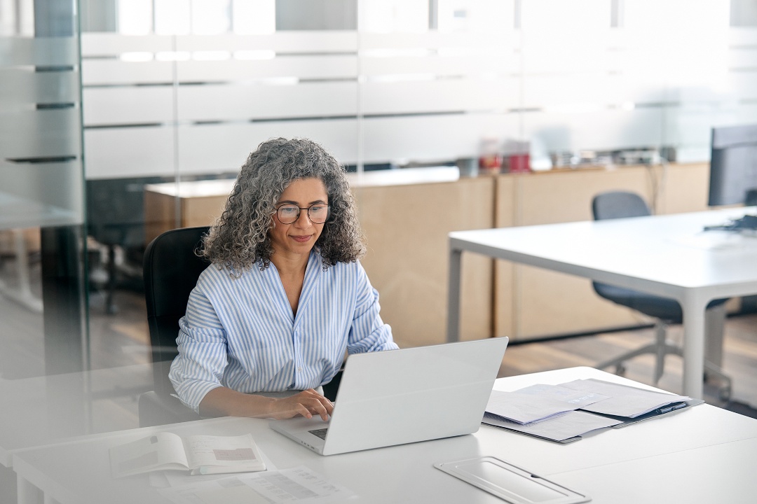 woman using laptop in office