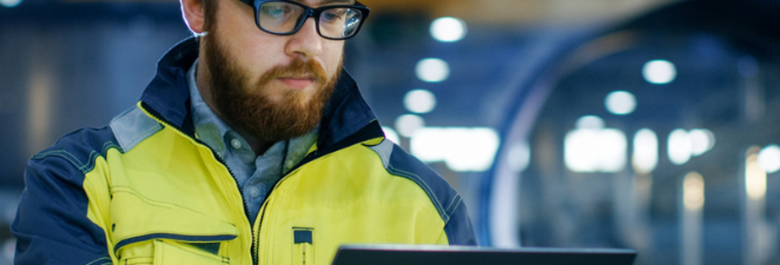 auditor wearing hard hat completing an audit