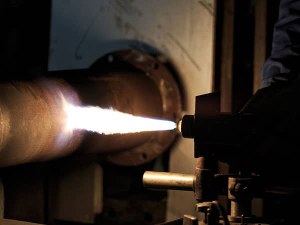 machine applying coating to product