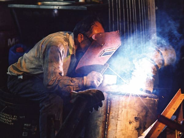 man welding