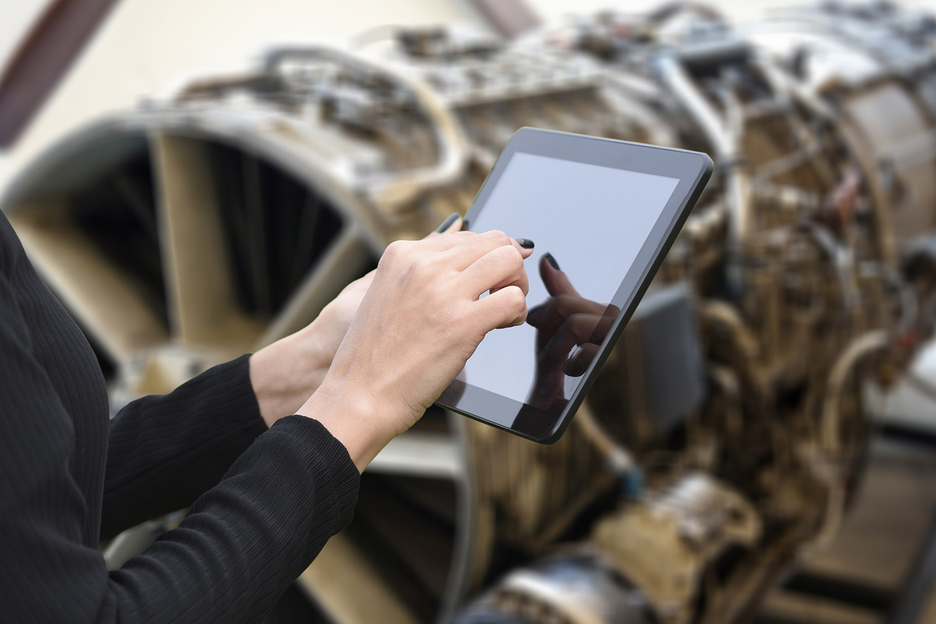 pri auditor using a tablet to conduct an audit