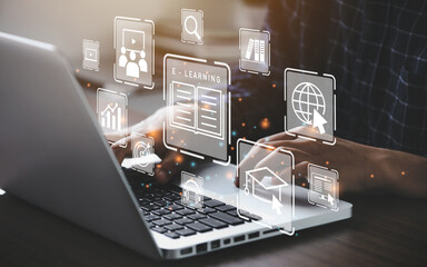 laptop with elearning icon popping out of keyboard