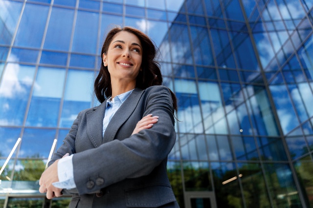 Corporate professional woman in front of headquarters