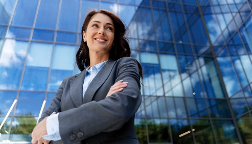 Corporate professional woman in front of headquarters