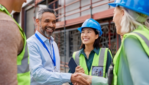 auditor shaking hands with group