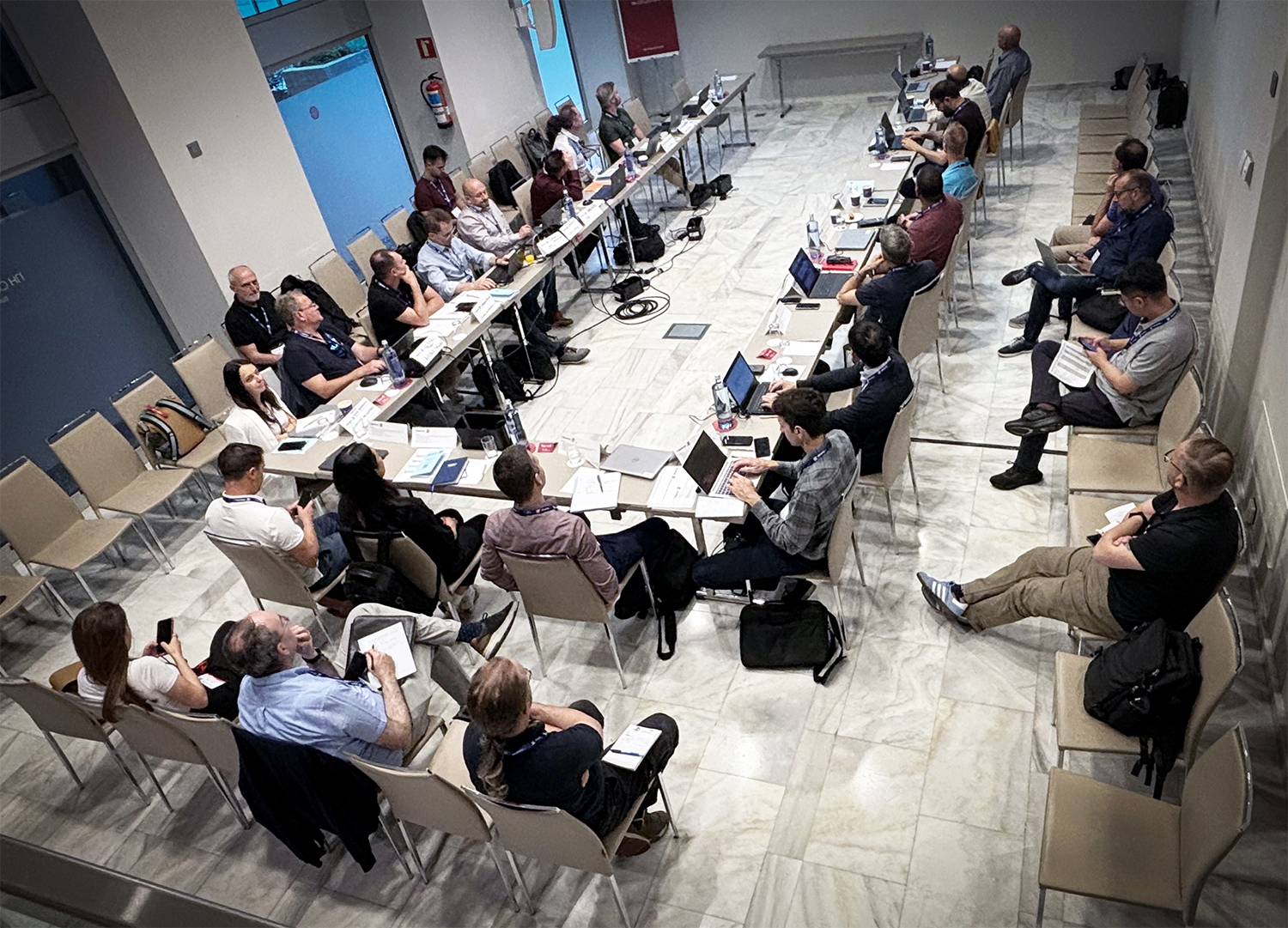 full meeting room at a table