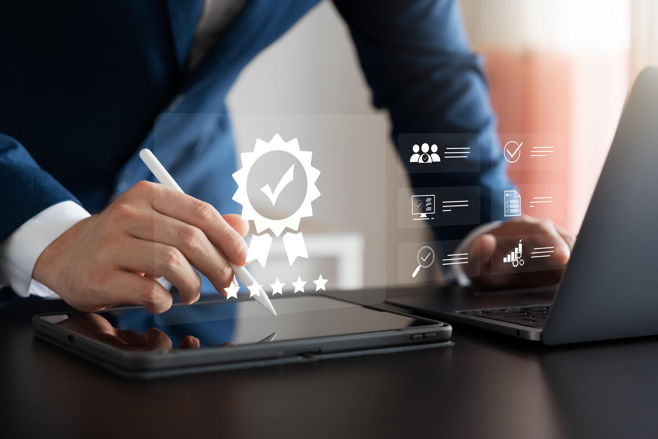 Businessman working with computers and tablet with icons