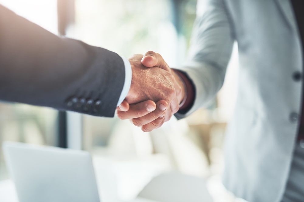 Close up of two business men shaking hands