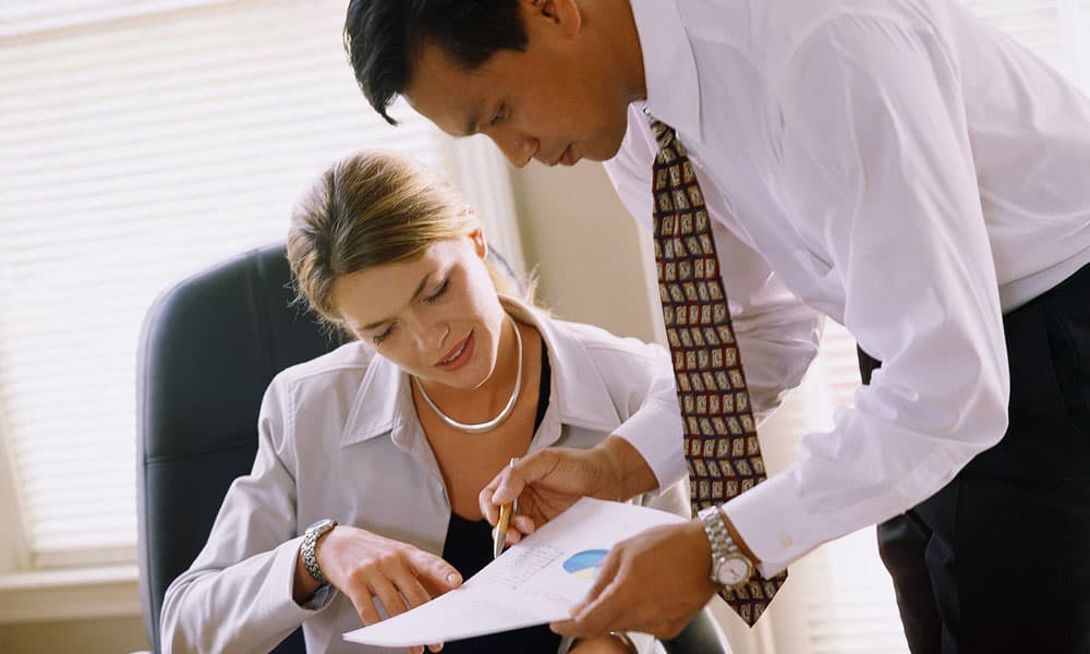 two colleagues discussing a paper