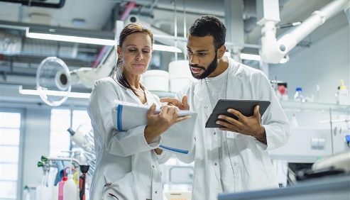 assessment taker talking to staff