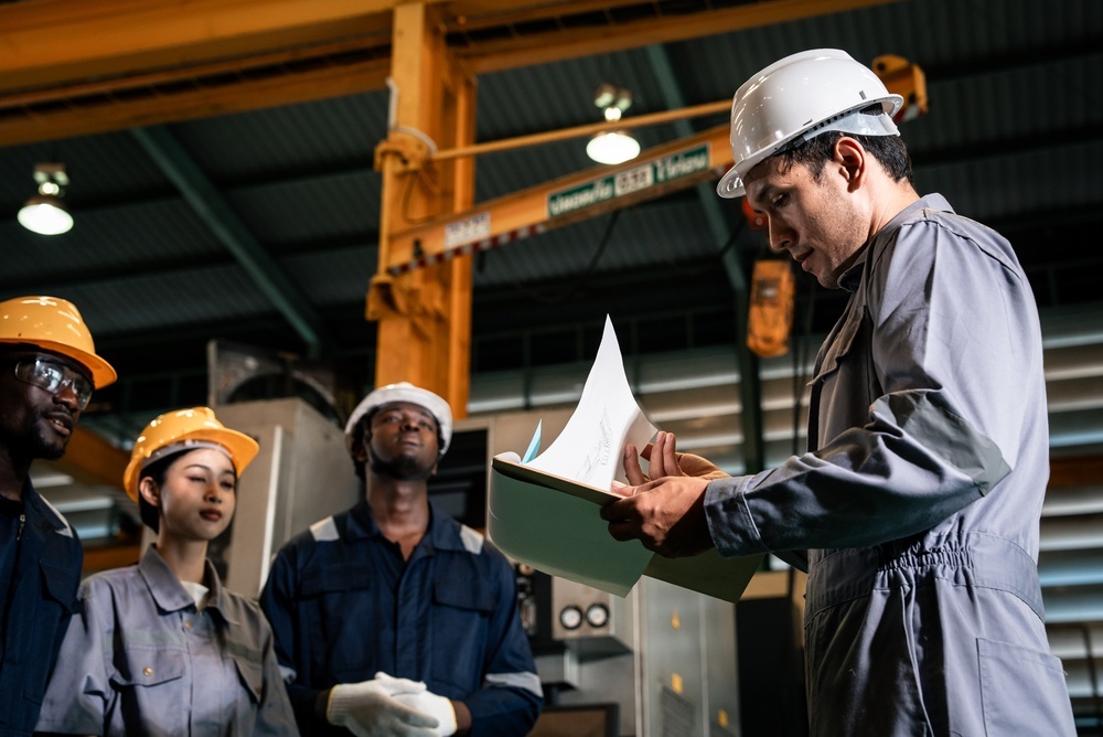 Man conducting audit on plant floor