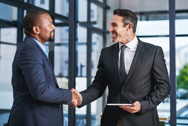 Two business partners shaking hands