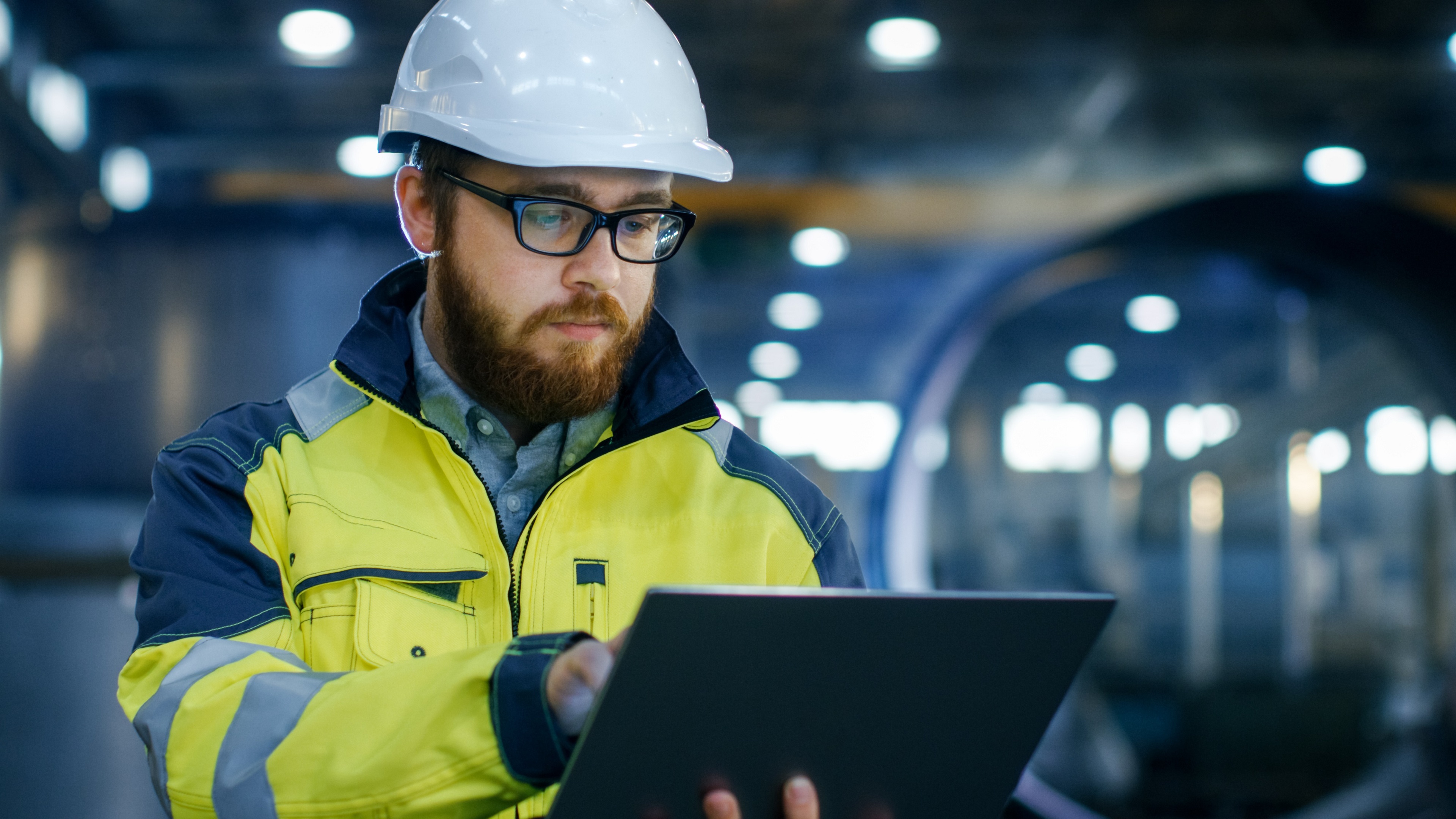 man reviewing ISO 9001certification criteria on a tablet