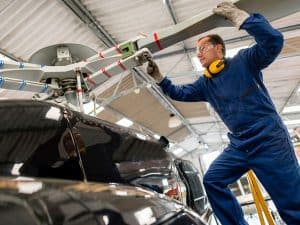 aerospace maintenance technician working on an aircraft