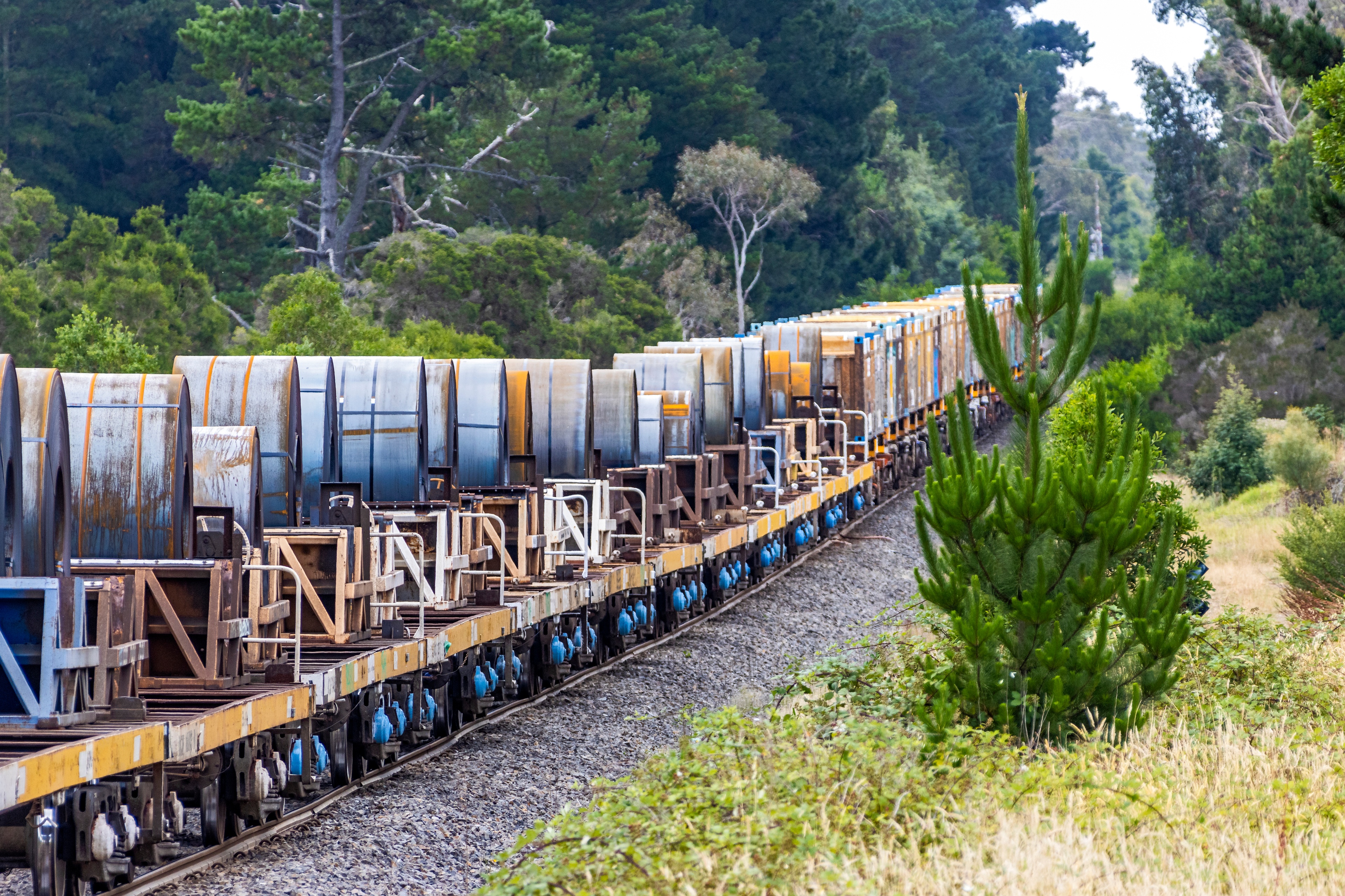 steel being hauled on a train